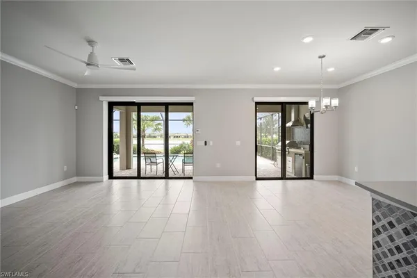 a view of large kitchen with a sink and a stove