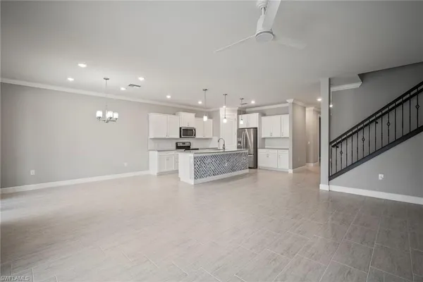 a view of a livingroom with a kitchen