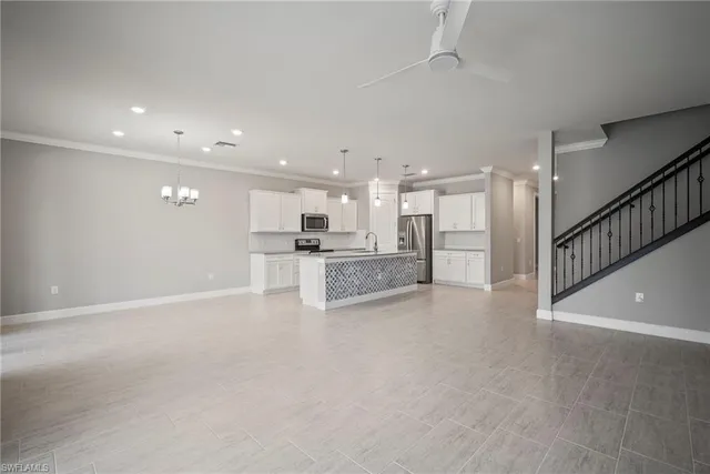 a view of a livingroom with a kitchen