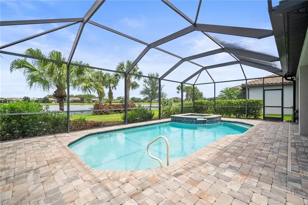 a view of swimming pool with a patio