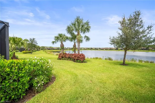 a view of a lake with houses in the back