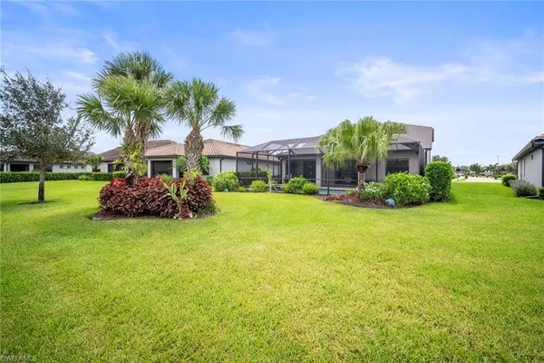 wooden floor with white walls and stairs