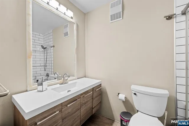 a bathroom with a shower and toilet