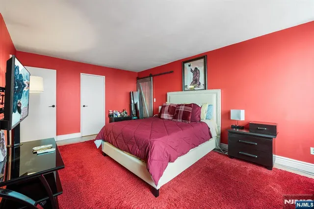 a view of a livingroom with furniture and a flat screen tv