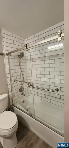 a view of a dining room with furniture and a chandelier