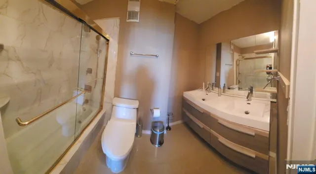 a room with lots of baby toys and flat screen tv