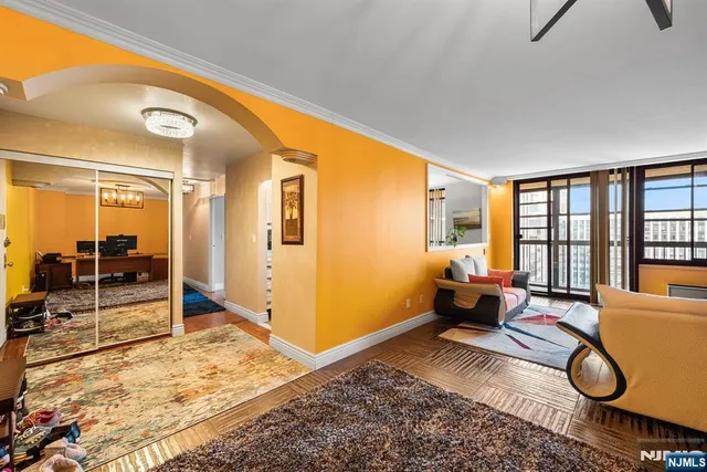 a spacious bedroom with a bed a table and chair