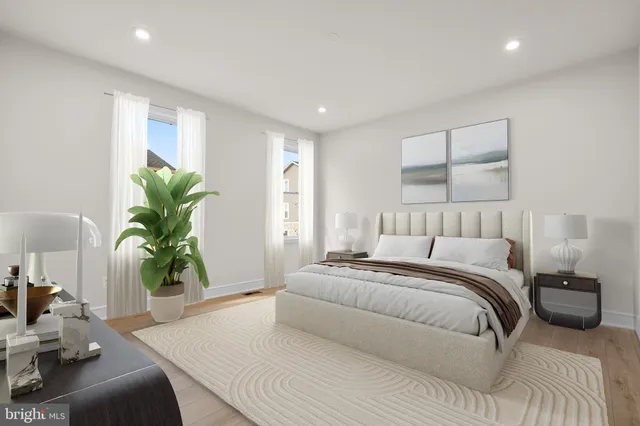 a bedroom with a bed and a couch