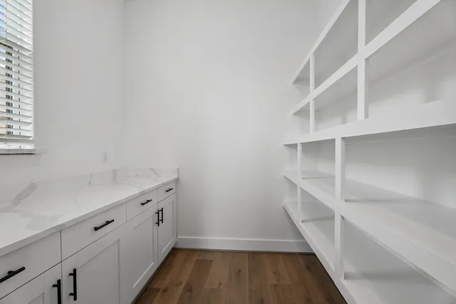 a view of an empty walk in closet with empty racks