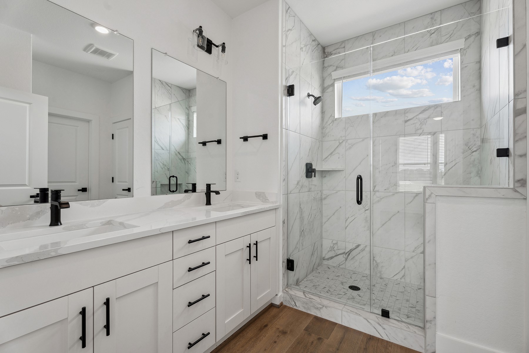1820 Drover Lane Rosenberg, TX 77471 - Photo 22 of 25 a bathroom with a double vanity sink mirror and shower
