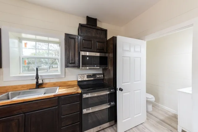 a view of a livingroom with wooden floor