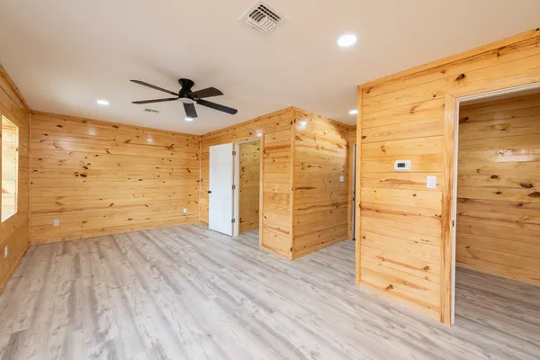 a bathroom with a sink a mirror and shower