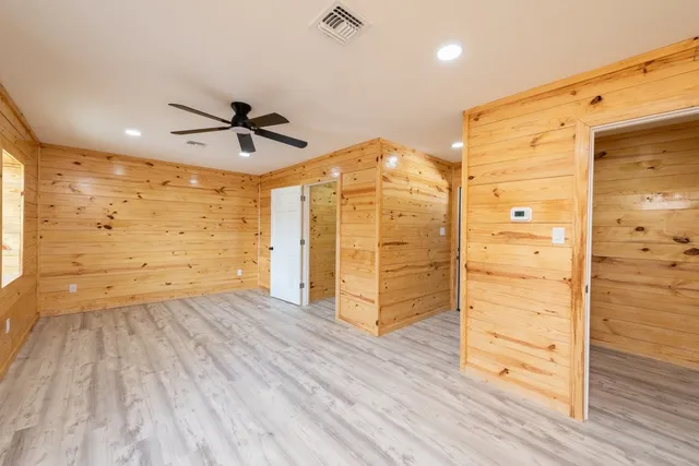 a bathroom with a sink a mirror and shower