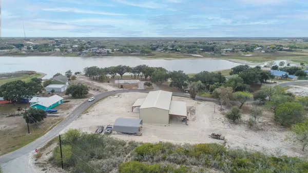 an aerial view of a house having yard