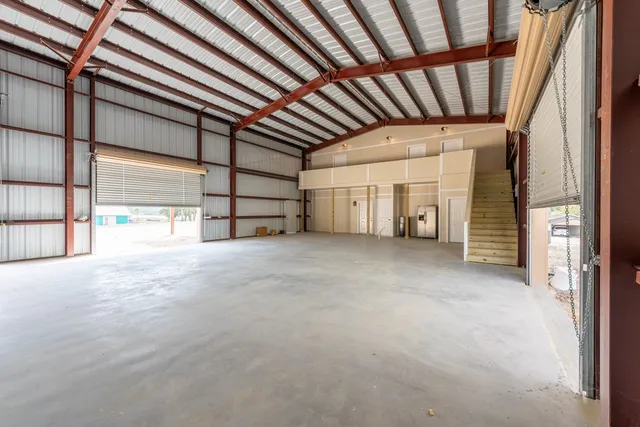 a view of an empty room with a fireplace