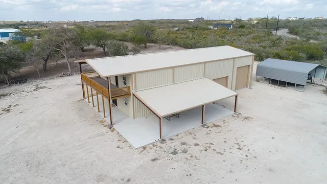 an aerial view of a house having yard