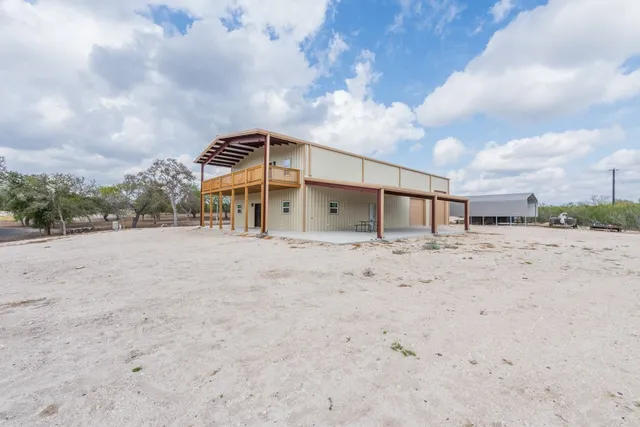 front view of a house with a wooden fence