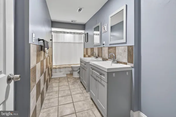 a kitchen with a sink stove and refrigerator