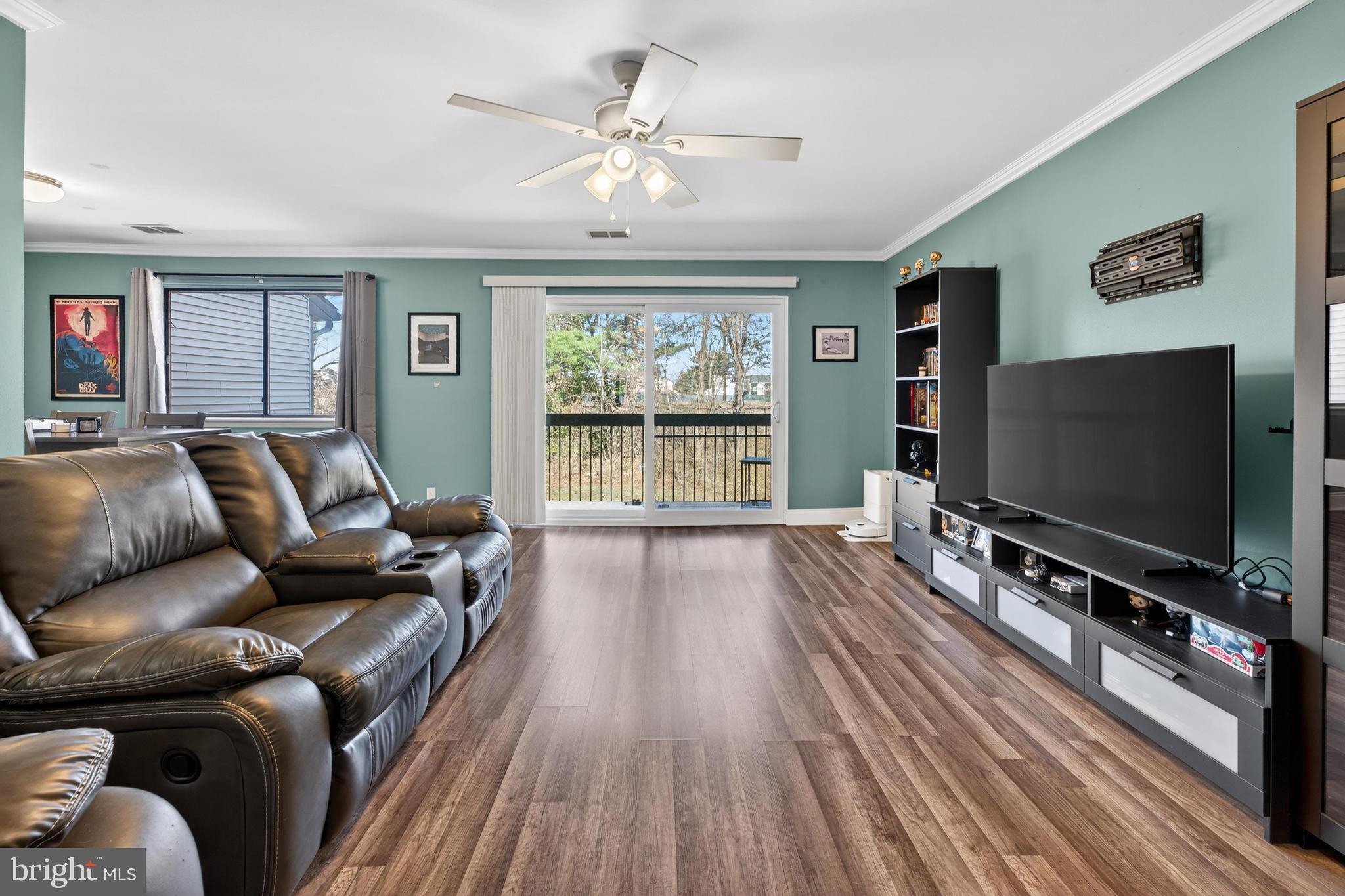 115 East Kings Highway, Unit 360 Maple Shade, NJ 08052 - Photo 5 of 20 a living room with furniture and a flat screen tv
