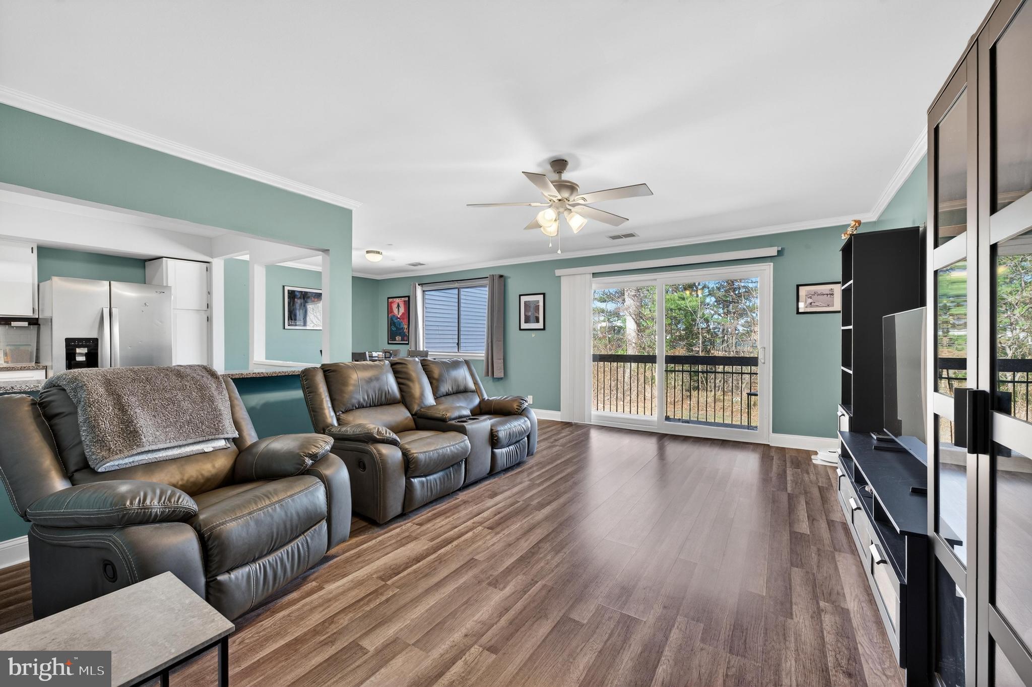 115 East Kings Highway, Unit 360 Maple Shade, NJ 08052 - Photo 6 of 20 a living room with furniture and a large window