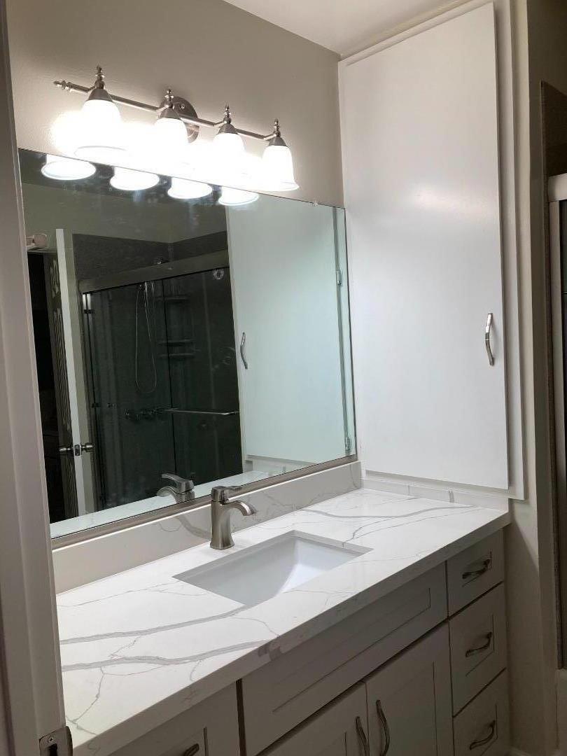 1010 Bryant Way, Unit E Sunnyvale, CA 94087 - Photo 5 of 13 a bathroom with a sink and a mirror