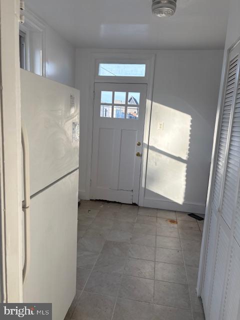 231 P Street Northwest Washington, DC 20001 - Photo 9 of 10 a view of a kitchen with white cabinets and refrigerator