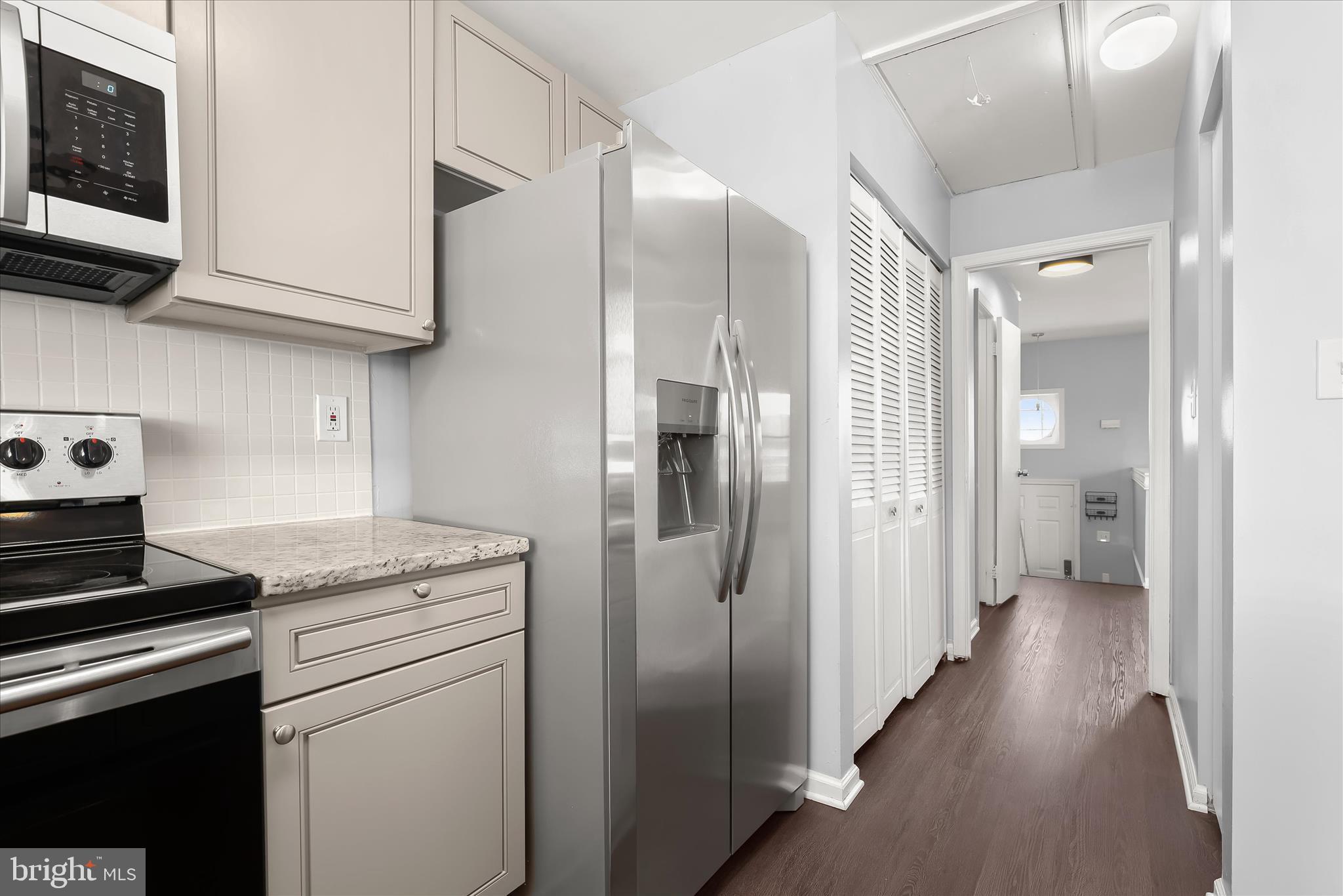 8624 Castlemill Circle Nottingham, MD 21236 - Photo 15 of 34 a kitchen with stainless steel appliances granite countertop a refrigerator a stove and a microwave