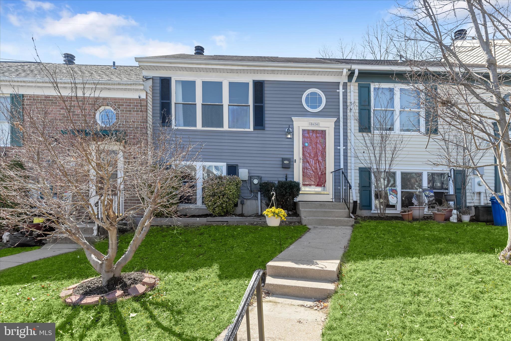 8624 Castlemill Circle Nottingham, MD 21236 - Photo 2 of 34 a front view of a house with garden