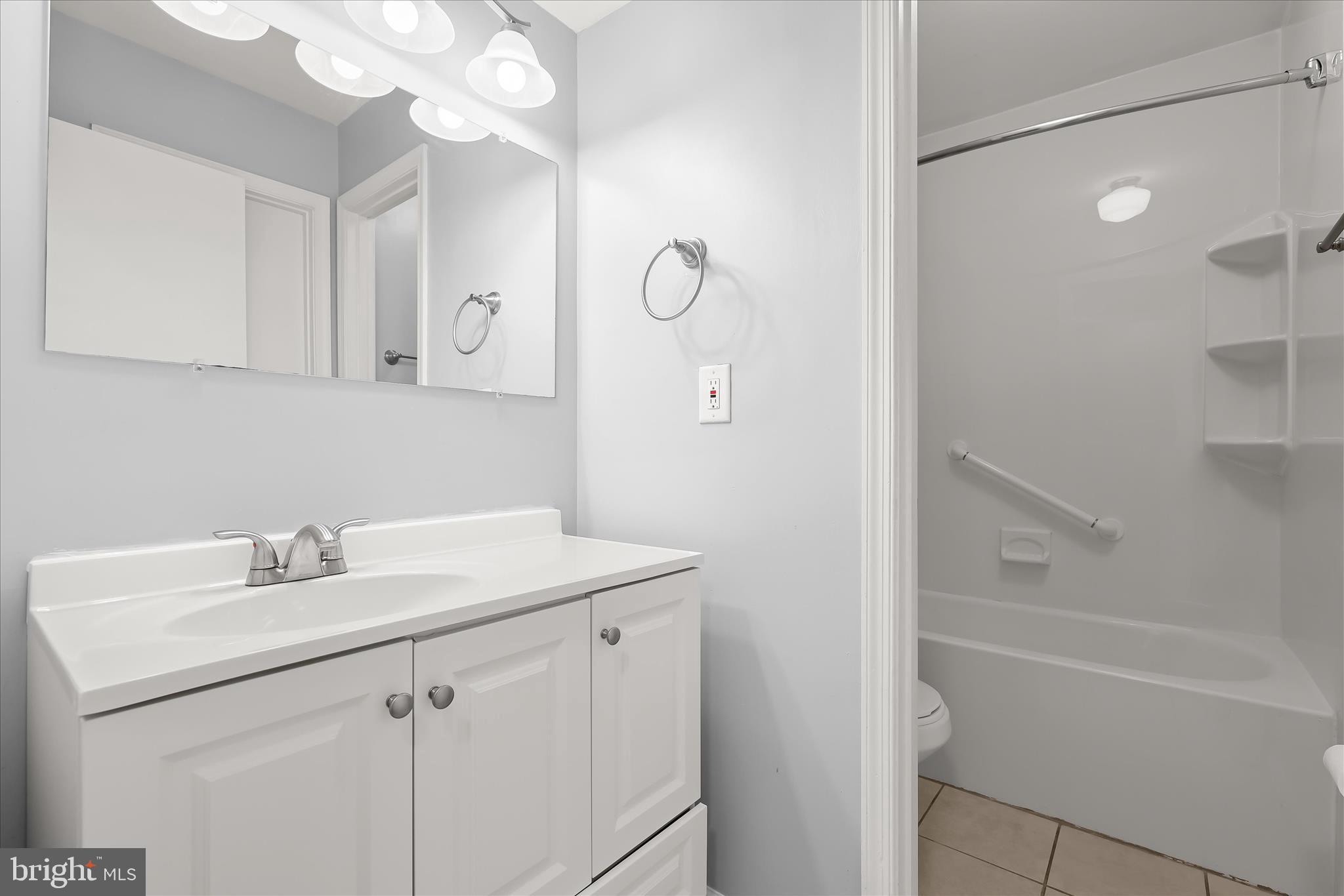 8624 Castlemill Circle Nottingham, MD 21236 - Photo 21 of 34 a bathroom with a sink vanity and mirror