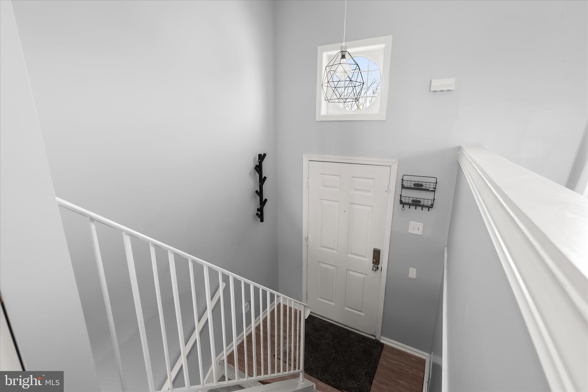 8624 Castlemill Circle Nottingham, MD 21236 - Photo 3 of 34 a view of a hallway with windows