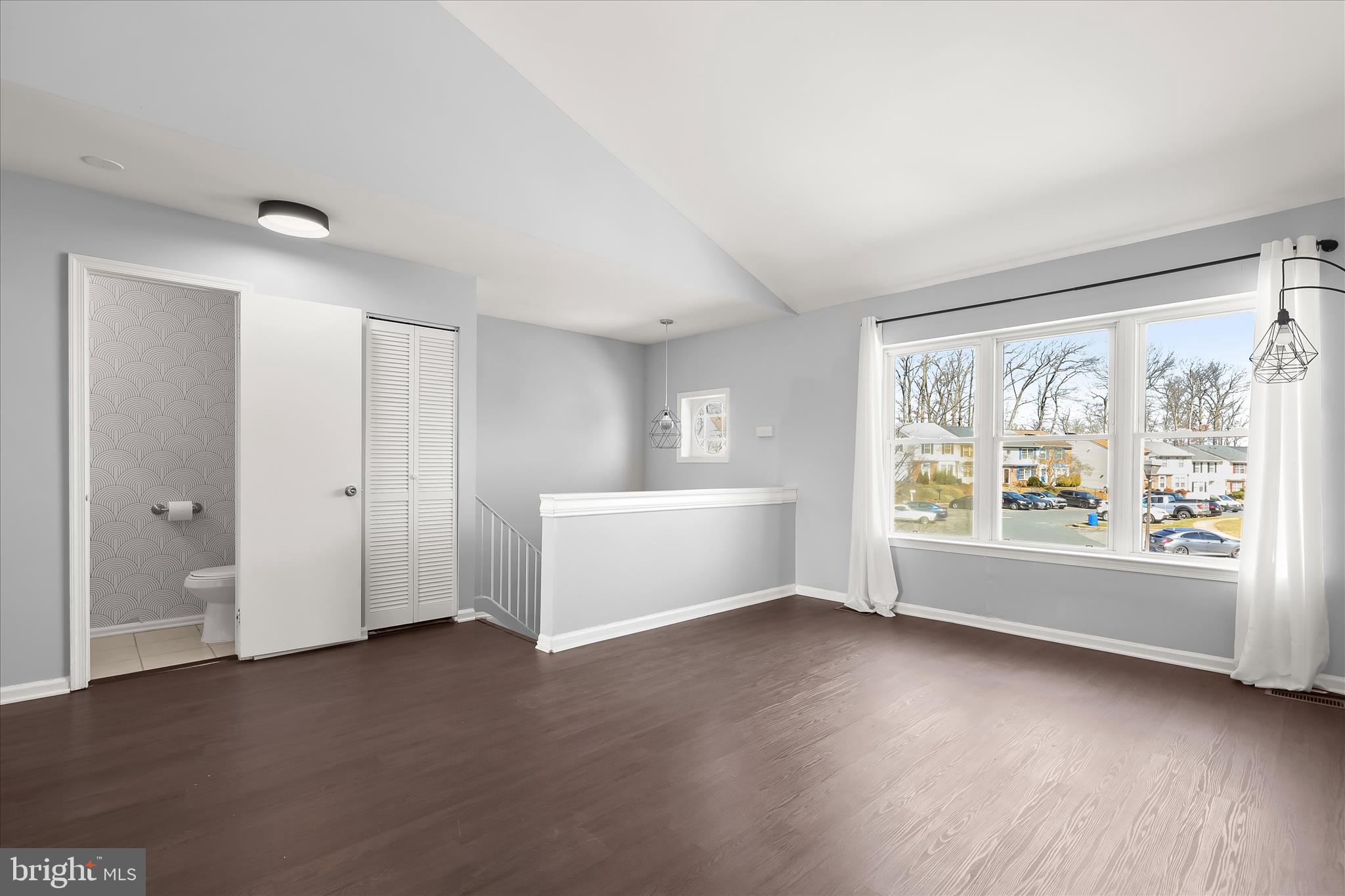 8624 Castlemill Circle Nottingham, MD 21236 - Photo 7 of 34 wooden floor in an empty room with a window