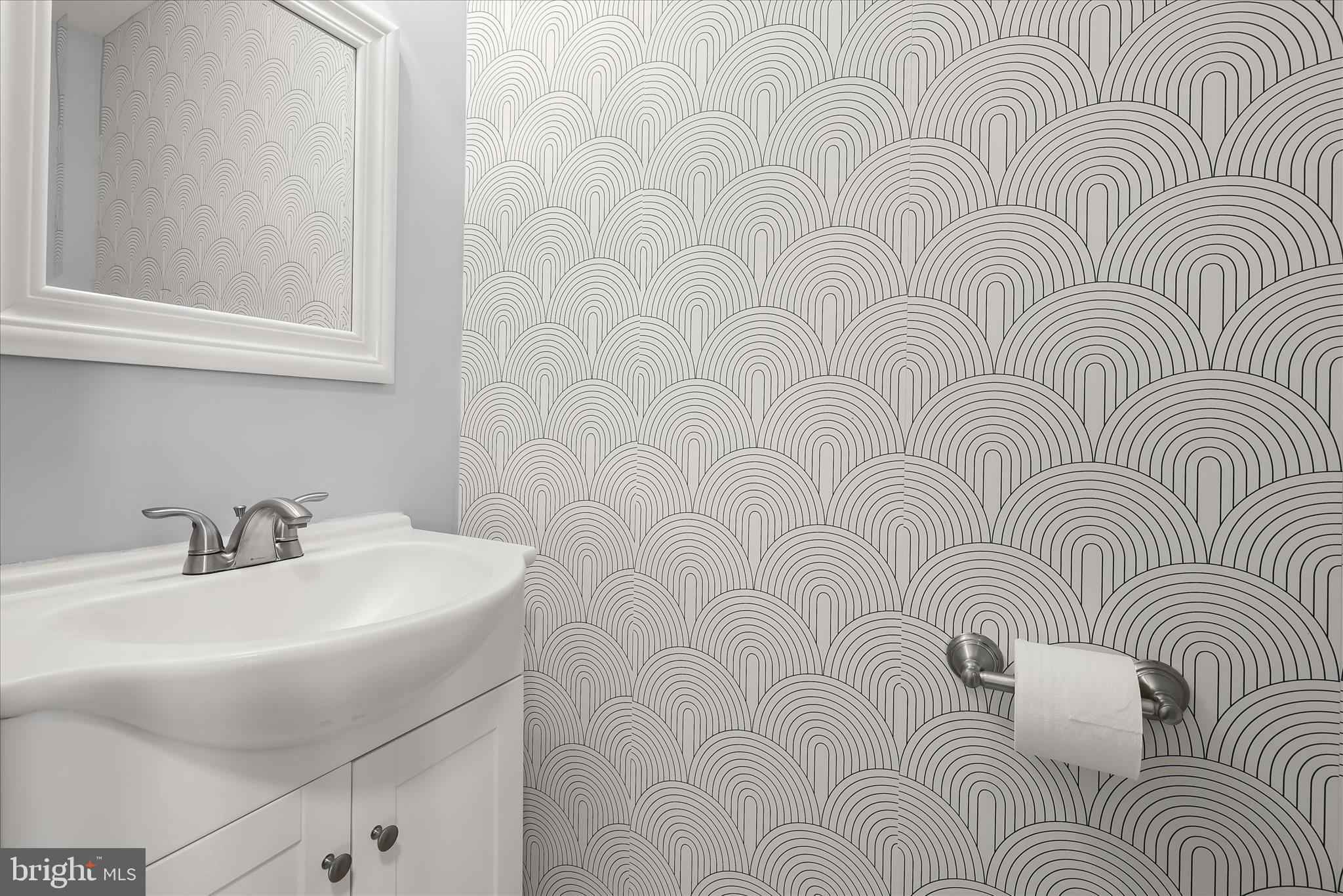 8624 Castlemill Circle Nottingham, MD 21236 - Photo 8 of 34 a bathroom with a sink and a mirror