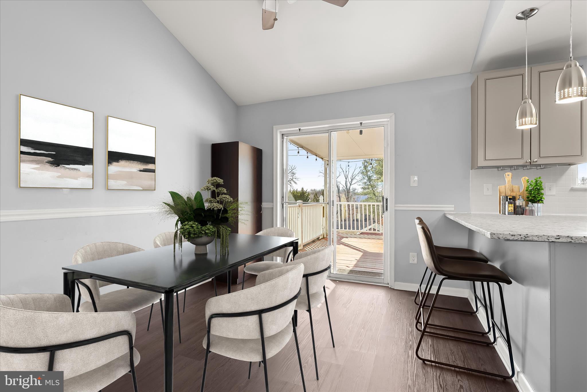 8624 Castlemill Circle Nottingham, MD 21236 - Photo 9 of 34 a view of a dining room with furniture and a potted plant