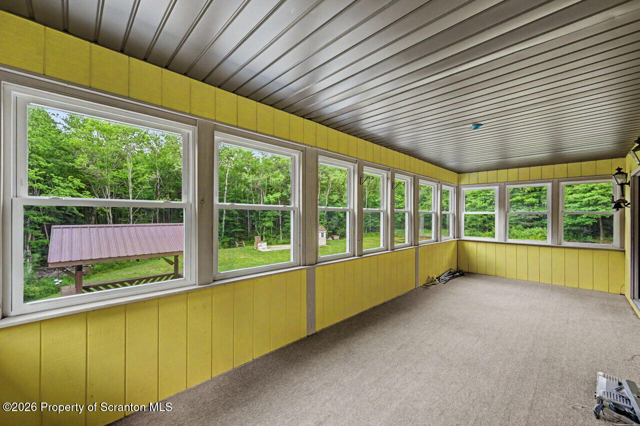 211 Buckingham Street Moscow, PA 18444 - Photo 32 of 83 a view of an empty room with a large window