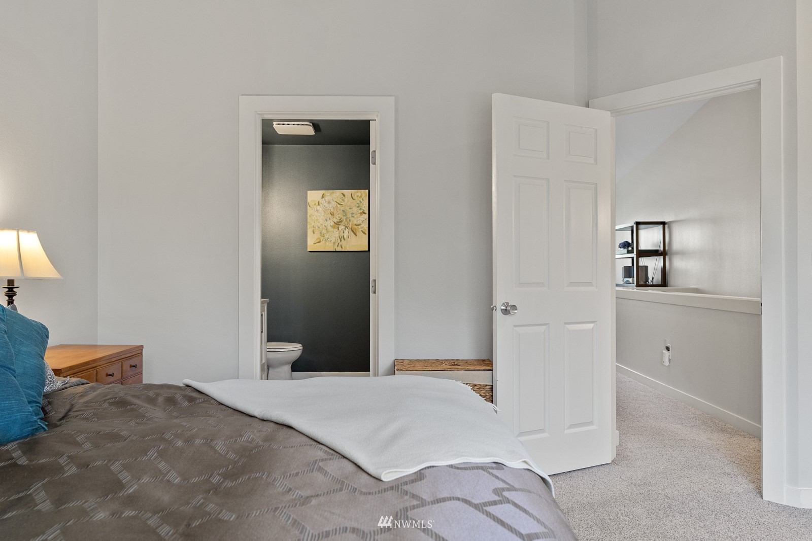 23908 Bothell Everett Highway, Unit C5 Bothell, WA 98021 - Photo 26 of 40 a bedroom with a bed and a lamp on dresser