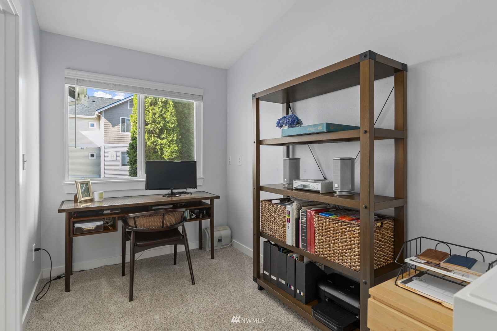 23908 Bothell Everett Highway, Unit C5 Bothell, WA 98021 - Photo 33 of 40 a view of a workspace with furniture and a window