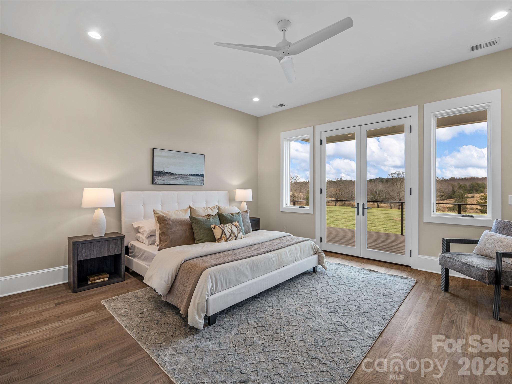 297 Mountain Meadows Lane, Unit 7 Tryon, NC 28782 - Photo 19 of 47 a bedroom with a large bed and a large window