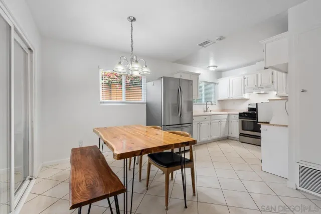 a kitchen with cabinets stainless steel appliances and a counter space
