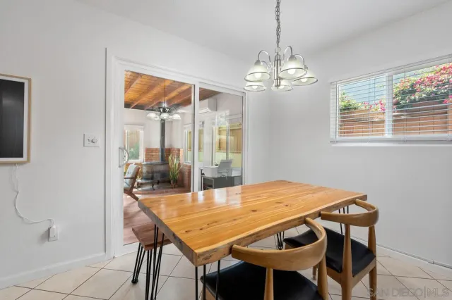 a kitchen with white cabinets and appliances