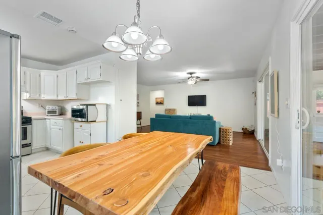 a dining room with furniture and window