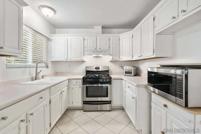 a view of a living room with furniture and a potted plant