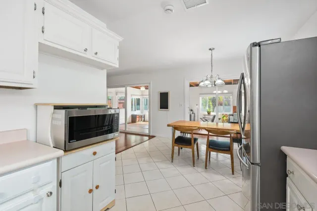 a bedroom with a bed and a ceiling fan