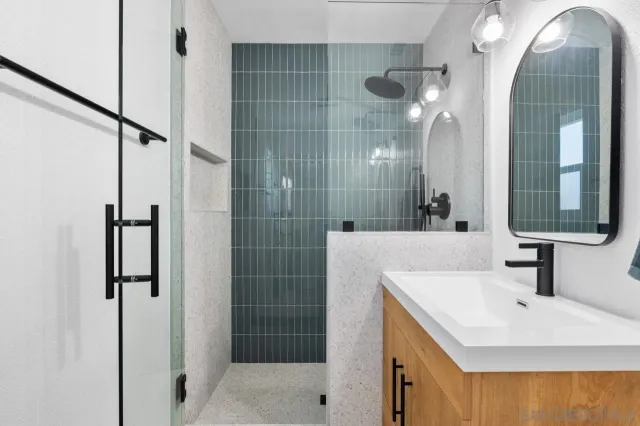 a bed room with a bed and a chandelier