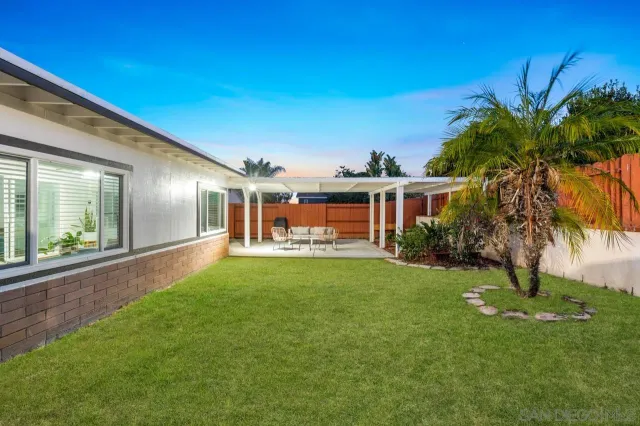a outdoor space with patio lots of furniture and white appliances
