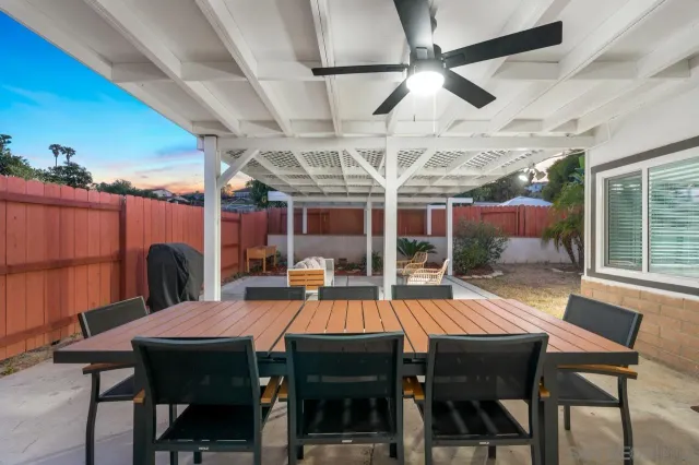 a outdoor living space with patio furniture and wooden floor