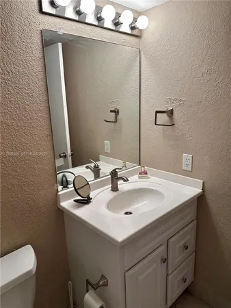 a bathroom with a sink and a toilet