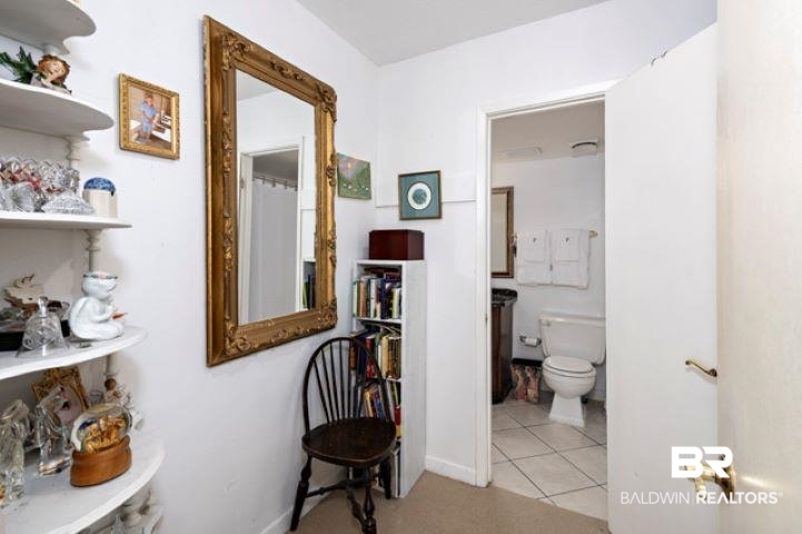 710 South Mobile Street, Unit 52 Fairhope, AL 36532 - Photo 21 of 58 Hall with light tile patterned floors and baseboards