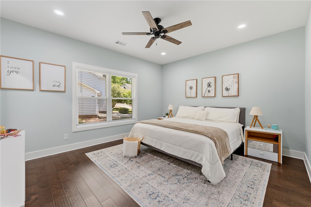 502 Canebrake Drive Anderson, SC 29621 - Photo 17 of 39 This serene bedroom offers ample light and hardwood flooring for comfortable living.