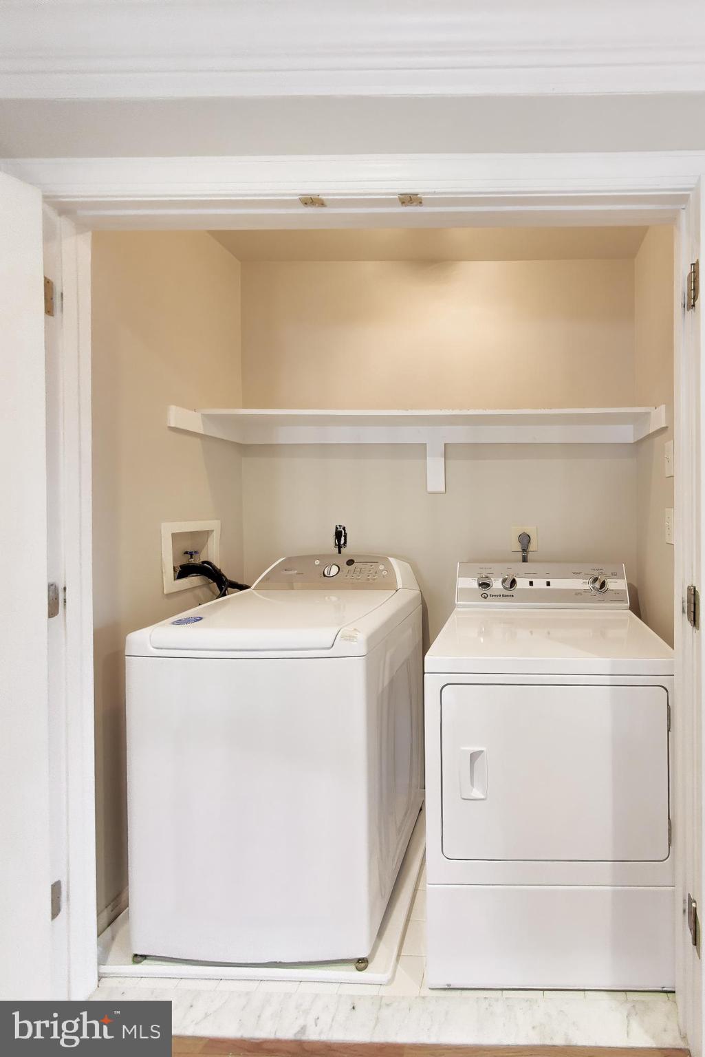9200 Linden Grove Court Silver Spring, MD 20910 - Photo 39 of 72 a utility room with dryer and washer