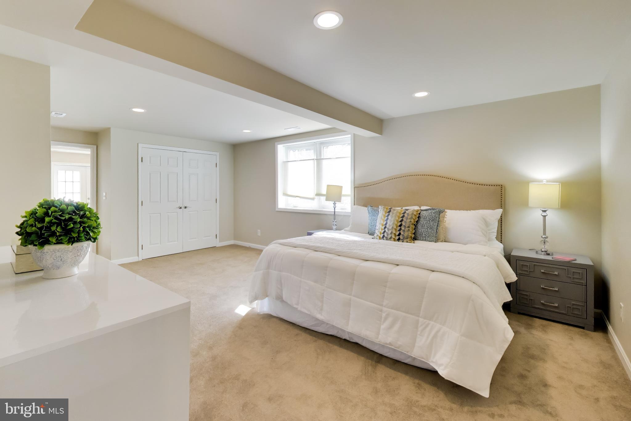 9200 Linden Grove Court Silver Spring, MD 20910 - Photo 48 of 72 a bedroom with a bed and a potted plant